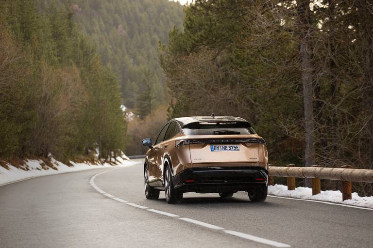 Nissan Ariya (2023) driving, rear view